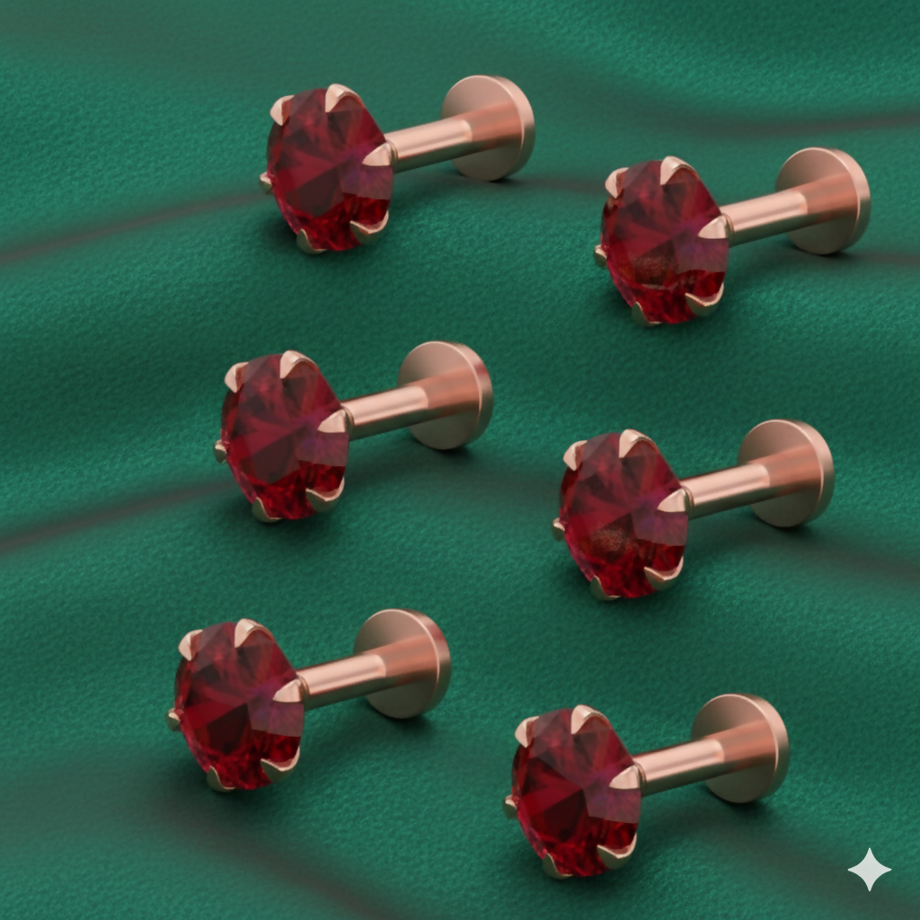 Close up of ruby red nose stud in rose gold plating with smooth flat back