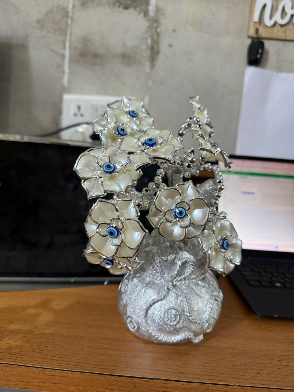 Stylish silver lucky flower tree statue displayed on wooden tabletop décor