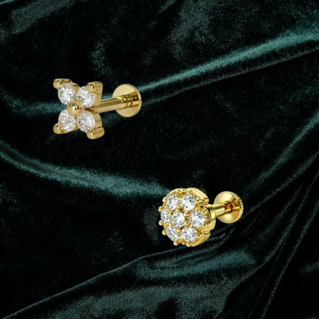 Close-up of flat-back gold plated crystal clover nosepin stud with sparkling CZ crystals