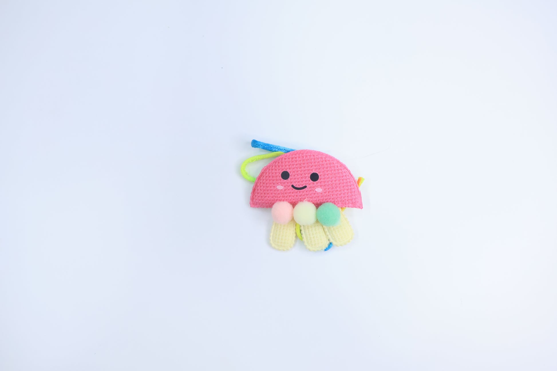 Cute Jellyfish Style Rakhi for Kids – Soft Fabric Rakhi with Pom-Poms and Colorful Thread
