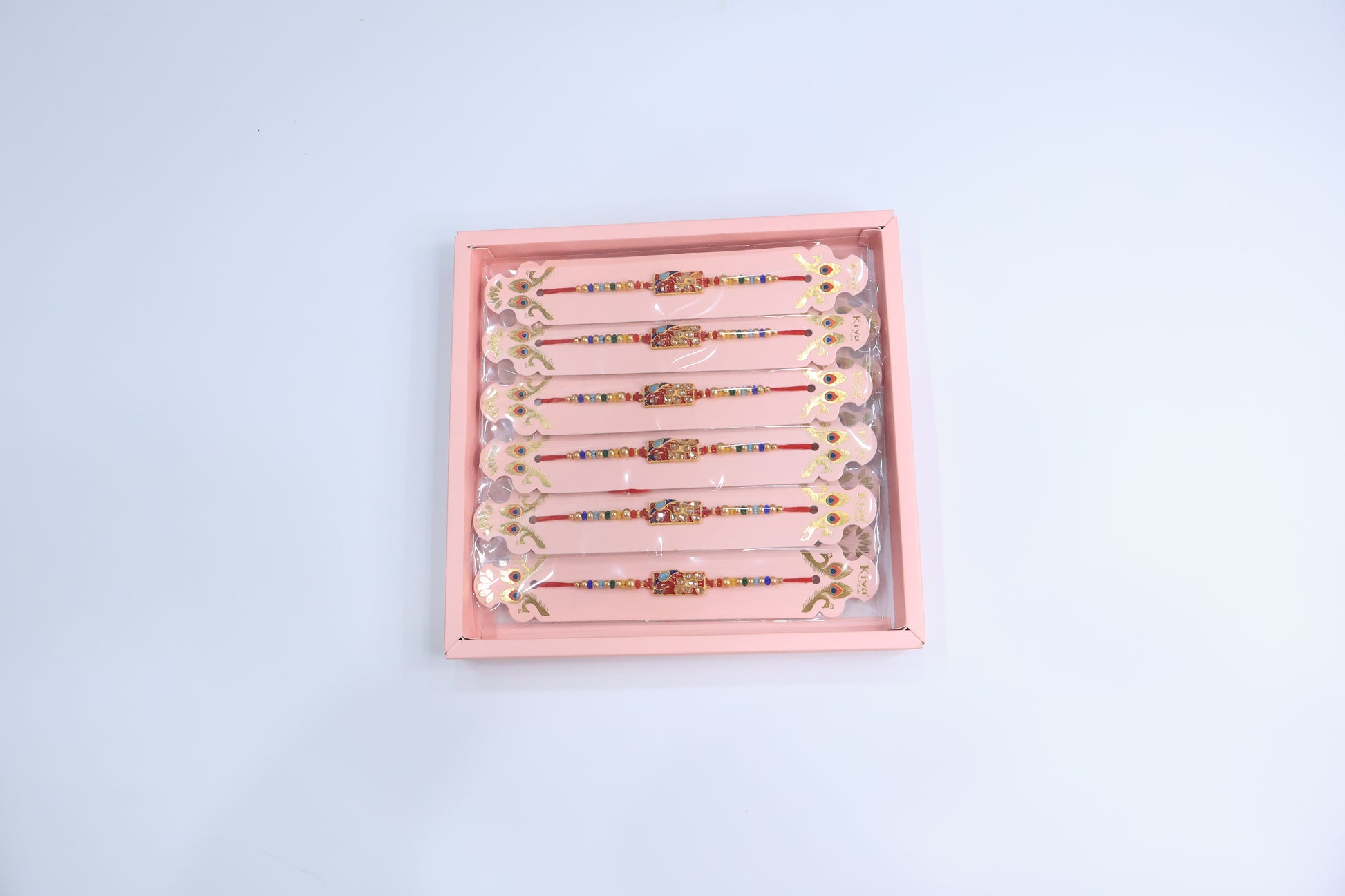 12 Pc Designer Peacock Kundan Rakhi Set with Red Enamel Dial and Multicolor Beads – Premium Traditional Gift Box for Raksha Bandhan