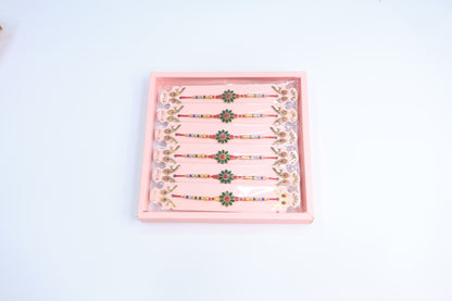 12 Pc Floral Stone Rakhi Set with Green & Pink Enamel Work and Multicolor Beads – Traditional Designer Rakhi Gift Box for Raksha Bandhan