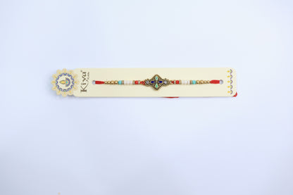 Ethnic Square Dial Rakhi with Multicolor Enamel Work and Decorative Beaded Thread