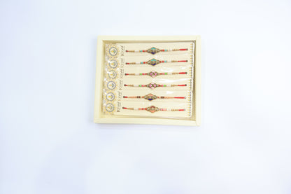 Combo Pack of 12 Geometric Designer Rakhis with Blue-Gold Dial and Multicolor Beaded Threads – Festive Gift Collection