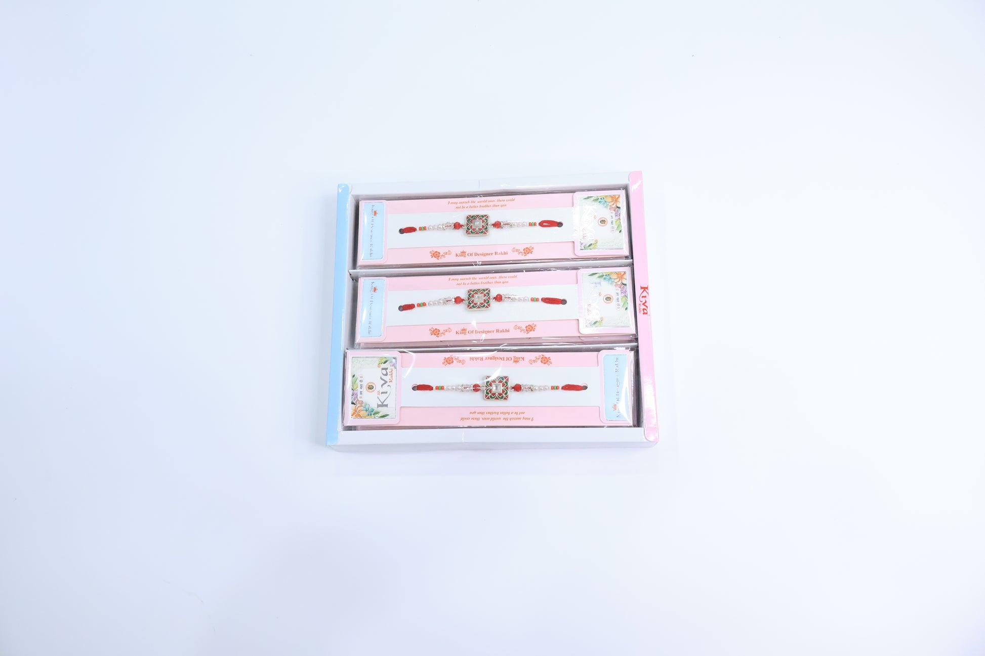 Combo Pack of 12 Designer Rakhis with Red-Green Enamel Square Motif and Pearl Beaded Thread – Premium Festive Gift Box