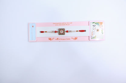 Elegant Square Swastik Rakhi with Green & Red Meenakari Work and Pearl Beads – Traditional Designer Thread for Raksha Bandhan