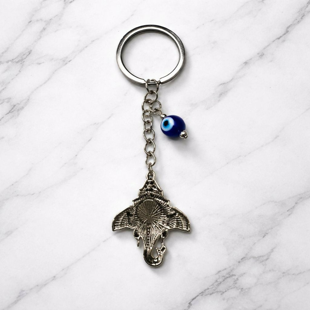Close-up of Ganesh charm and evil eye centerpiece