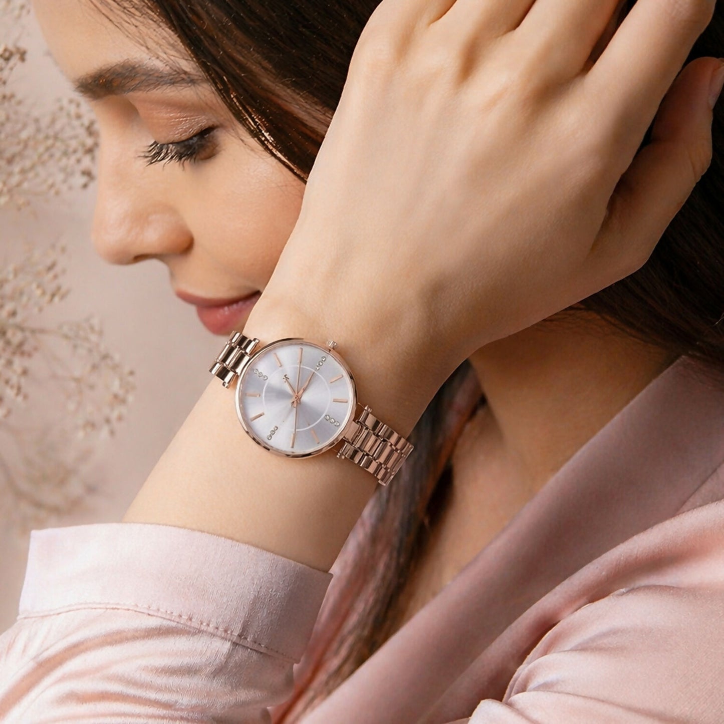 Women's rose gold watch on wrist for casual wear