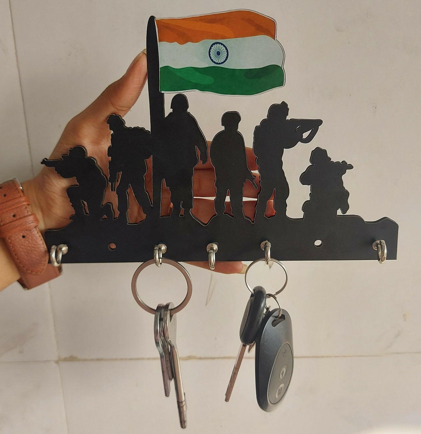 Indian Army key holder mounted on a wall in a home setting