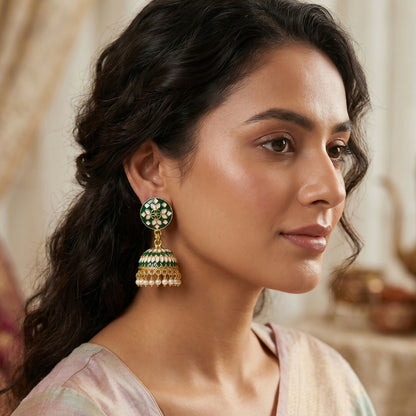 Side view of green round stud jhumka earrings with pearl drops