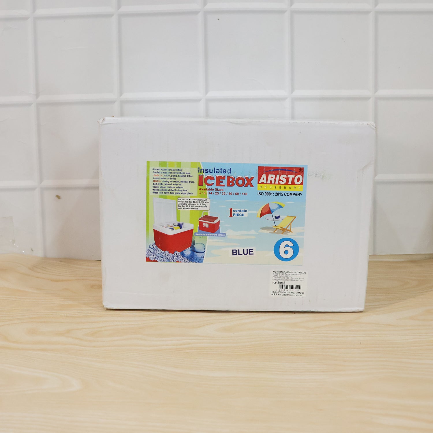 Blue portable insulated ice cooler box shown in use