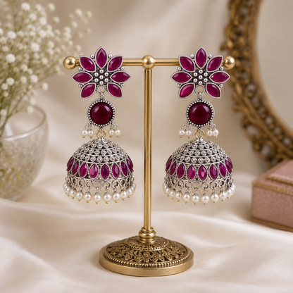 Side angle showing intricate craftsmanship of oxidized silver Jhumkha earrings