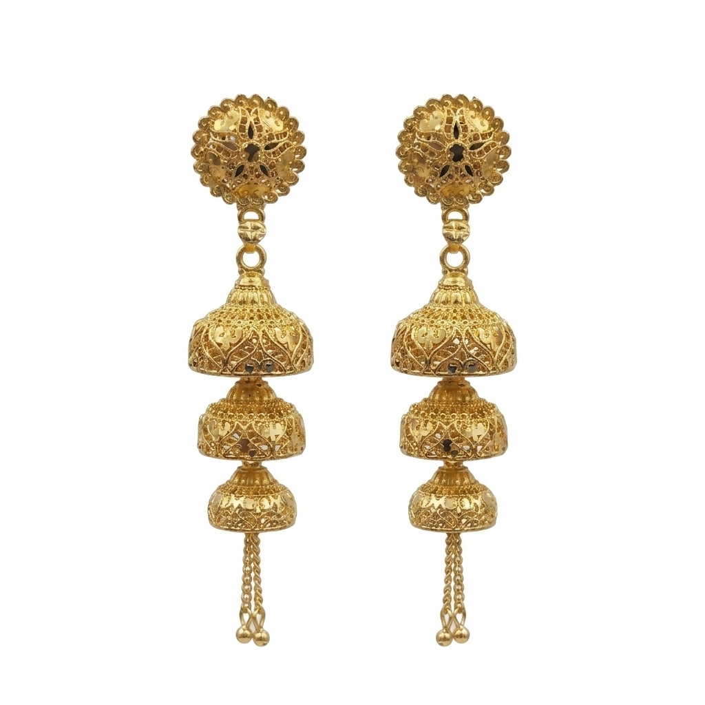 Elegant gold jhumka earrings on a display