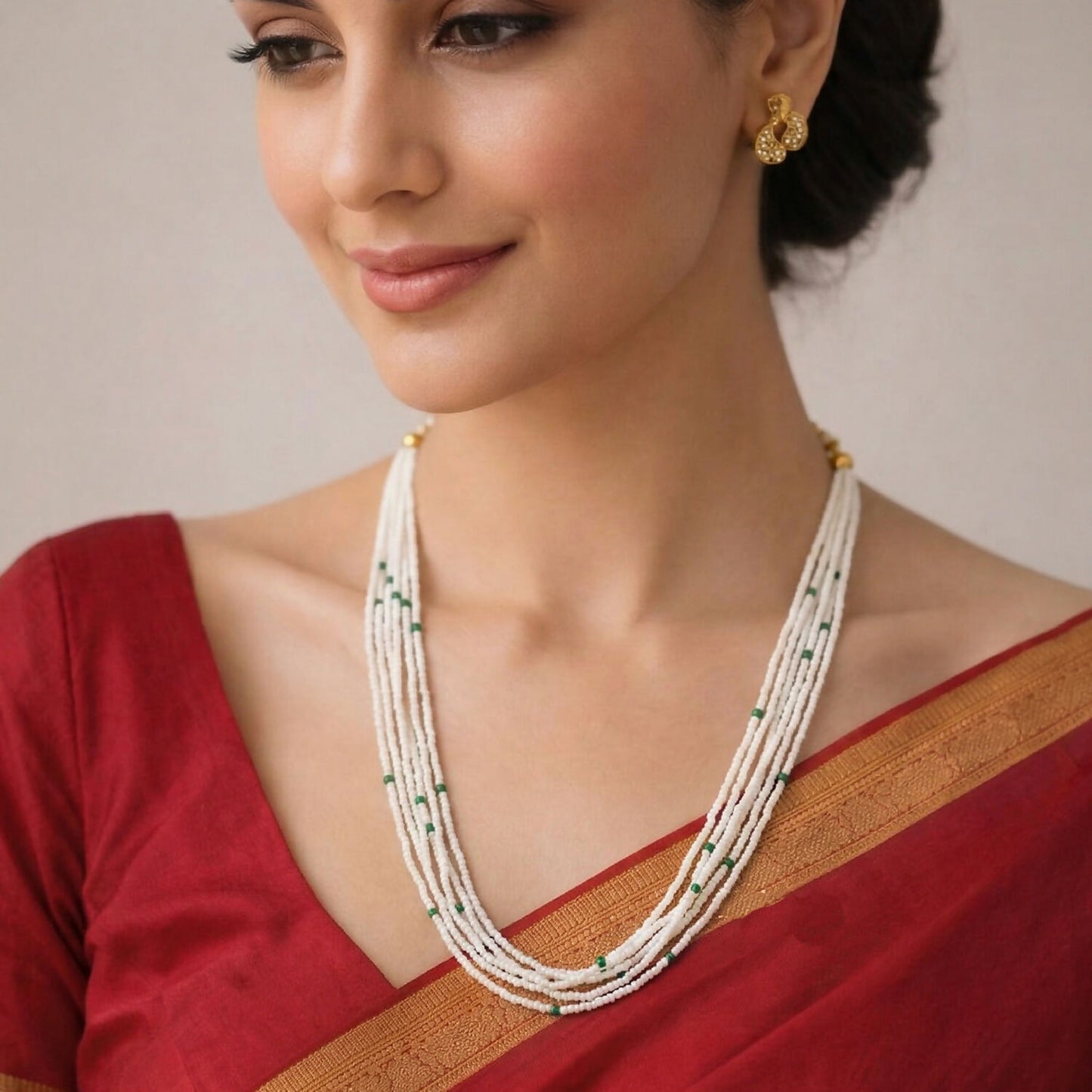 Elegant multi-layered pearl necklace being worn on a model
