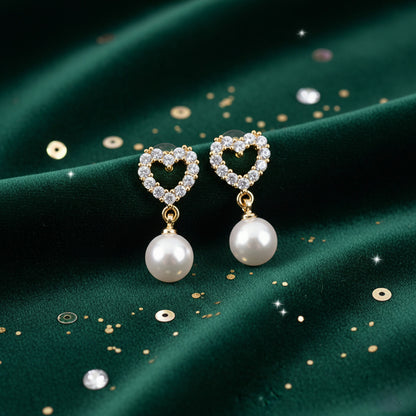 Elegant heart shape pearl drop earrings featuring CZ-studded open heart design