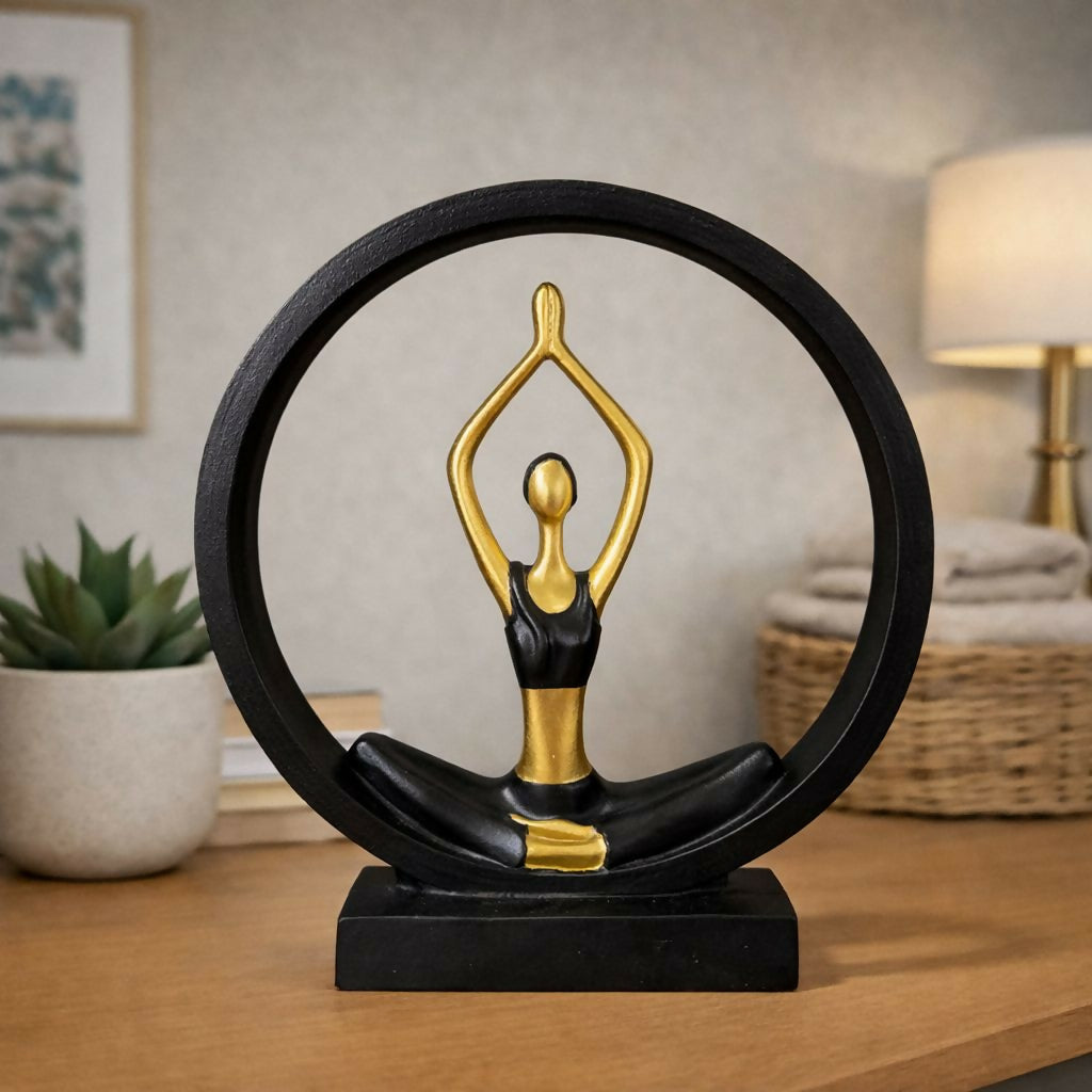 Black gold yoga meditation figurine showing a yoga pose inside circular frame