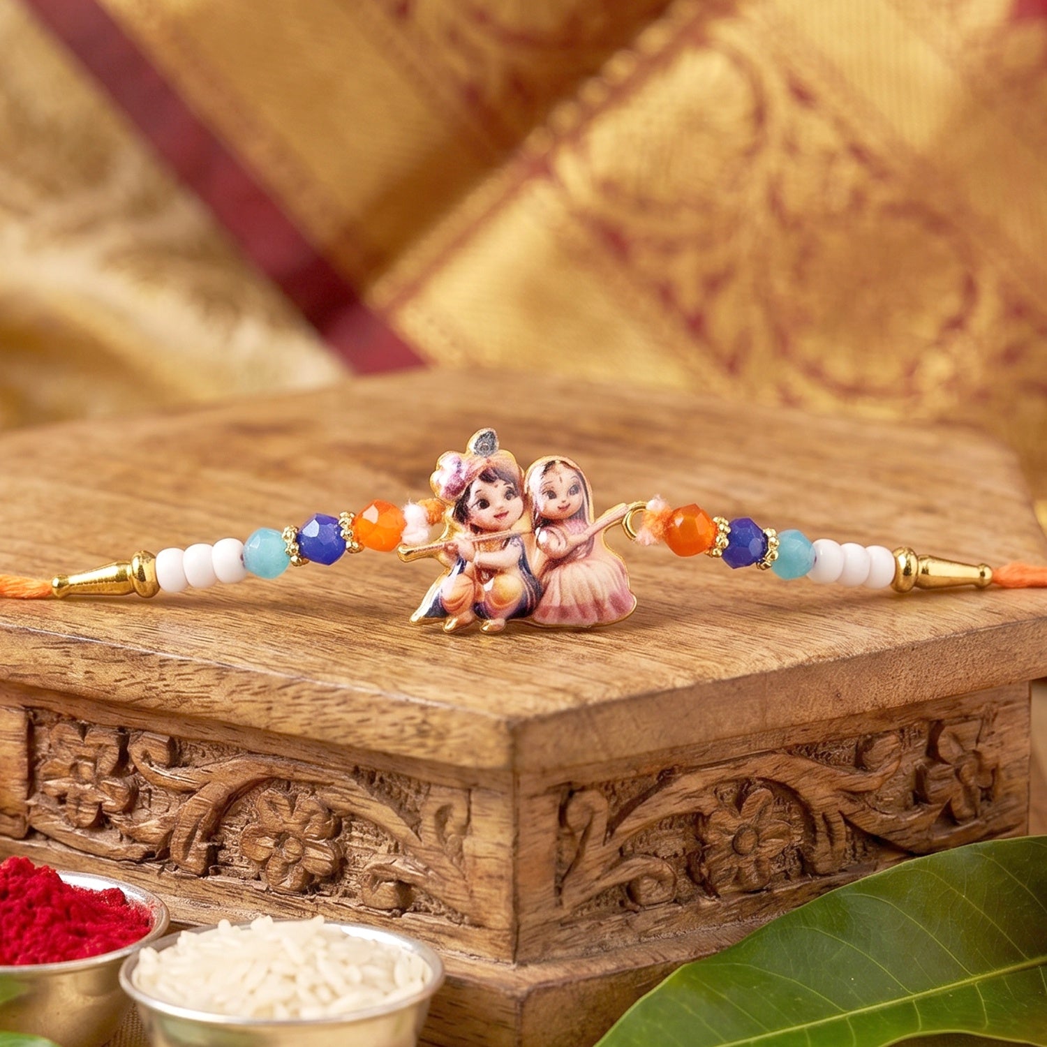 Elegant Radha Krishna Rakhi with decorative beads