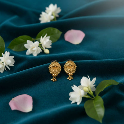 Golden jhumka earrings with intricate filigree and colorful enamel accents