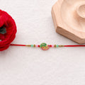 Mini Krishna Peacock Leaf Rakhi – Traditional Raksha Bandhan Design