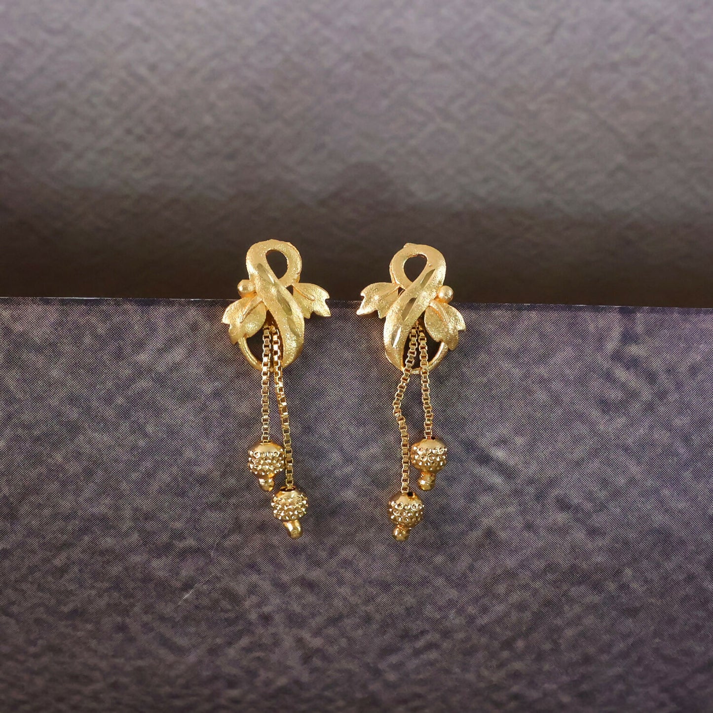Regal Botanical Motif Gold Drop Earrings with Cascading Chain Bead Accents