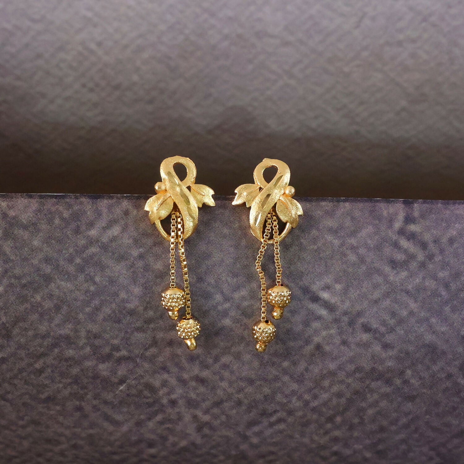 Regal Botanical Motif Gold Drop Earrings with Cascading Chain Bead Accents