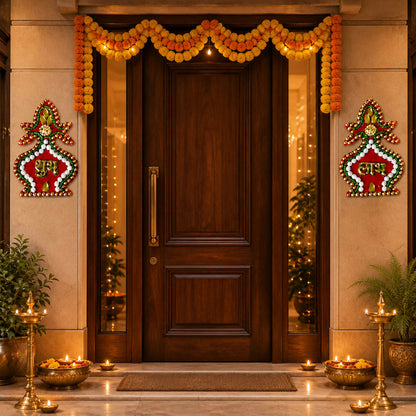 A festive home entrance decorated with marigold garlands, diyas, and Shubh Labh stickers on either side of the door.