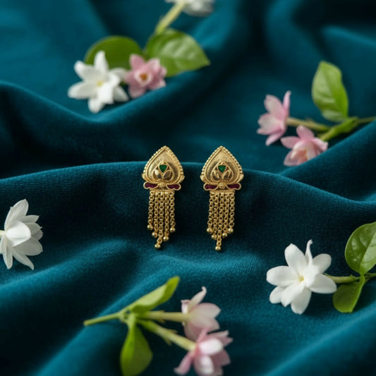 Golden jhumka earrings with intricate filigree and blue-green enamel detailing