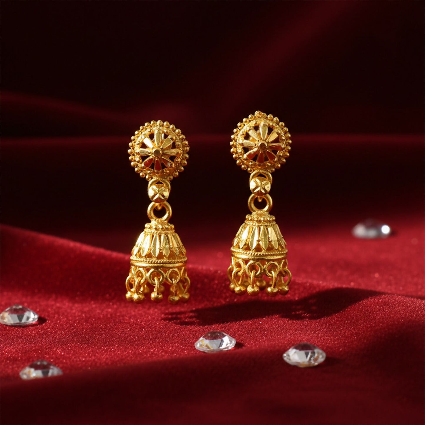 Close-up of floral design and bead detailing on gold plated jhumka earrings