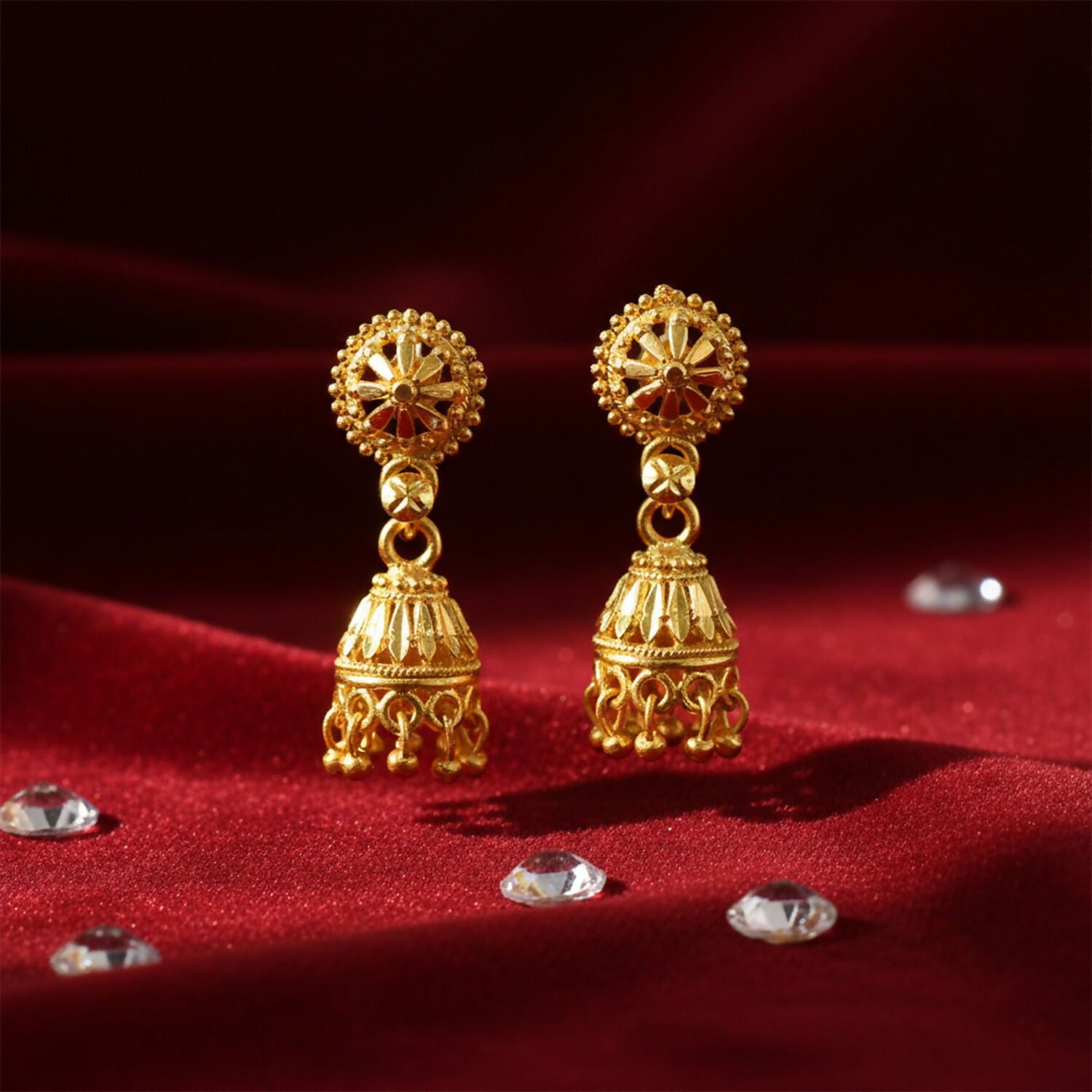 Close-up of floral design and bead detailing on gold plated jhumka earrings