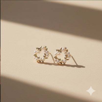 Pearl wreath stud earrings worn on ear, elegant look