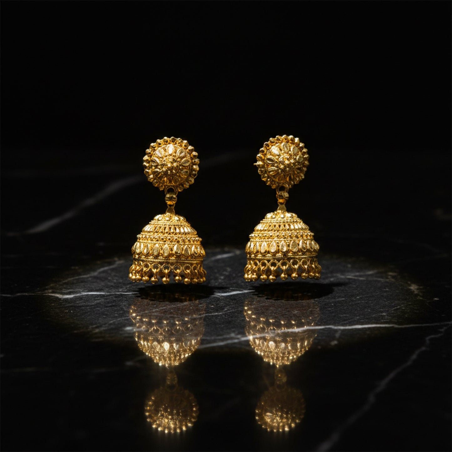 Gold plated jhumka earrings styled with ethnic outfit