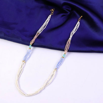Close-up of pastel pearl necklace layers with mint, lavender and peach beads