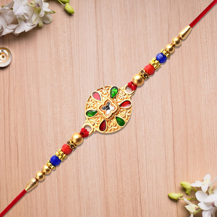 Elegant Gold Rakhi with Intricate Design: A Symbol of Love and Protection