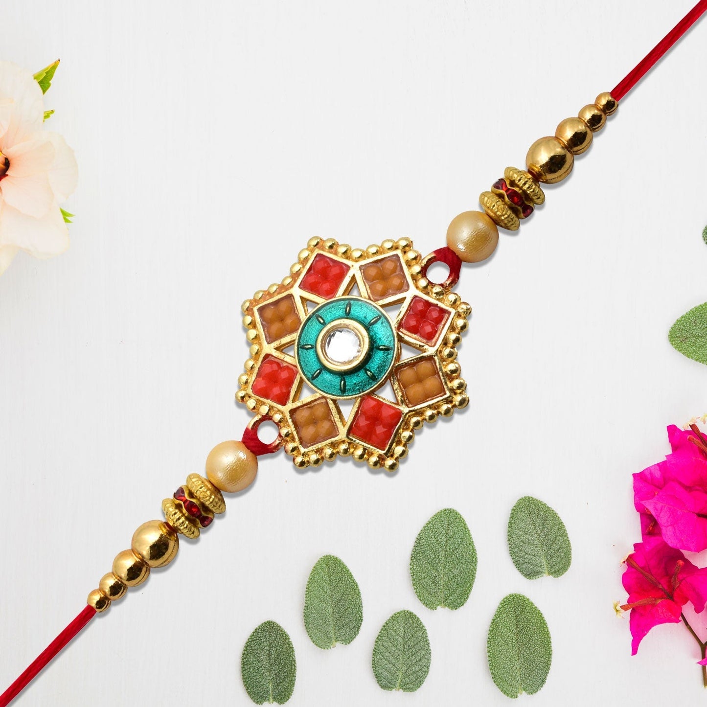 Top view of the Traditional Unique Shape Rakhi laid on white background showcasing its unique shape and design