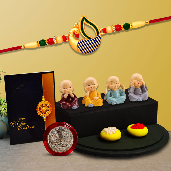 Mor Design Rakhi With Decorative Baby Buddha Gift ,Silver Color Pooja Coin, Roli Chawal & Greeting Card