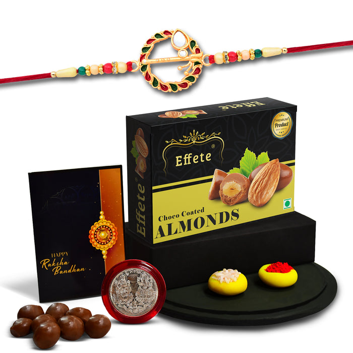 Flute In Circle With Red & Green Beads With Effete Choco Almond Chocolate 32Gm ,Silver Color Pooja Coin, Roli Chawal & Greeting Card