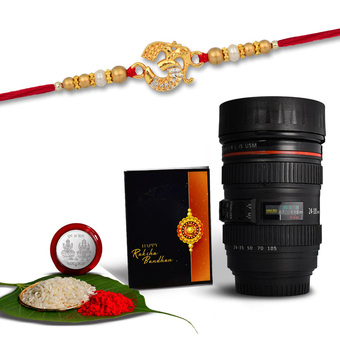 Om Golden Color Rakhi With Diamonds With Coffee Camera Lense Mug ,Silver Color Pooja Coin, Roli Chawal & Greeting Card