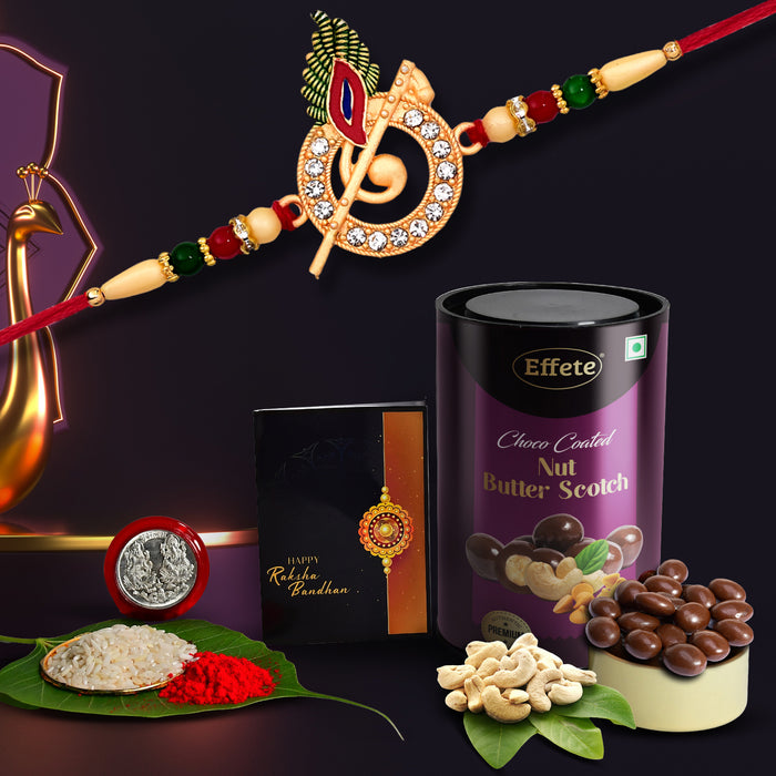 Krishna Rakhi Combo with Effete Butterscotch Chocolate nuts 96gm, Silver Color Pooja Coin, Roli Chawal & Greeting Card