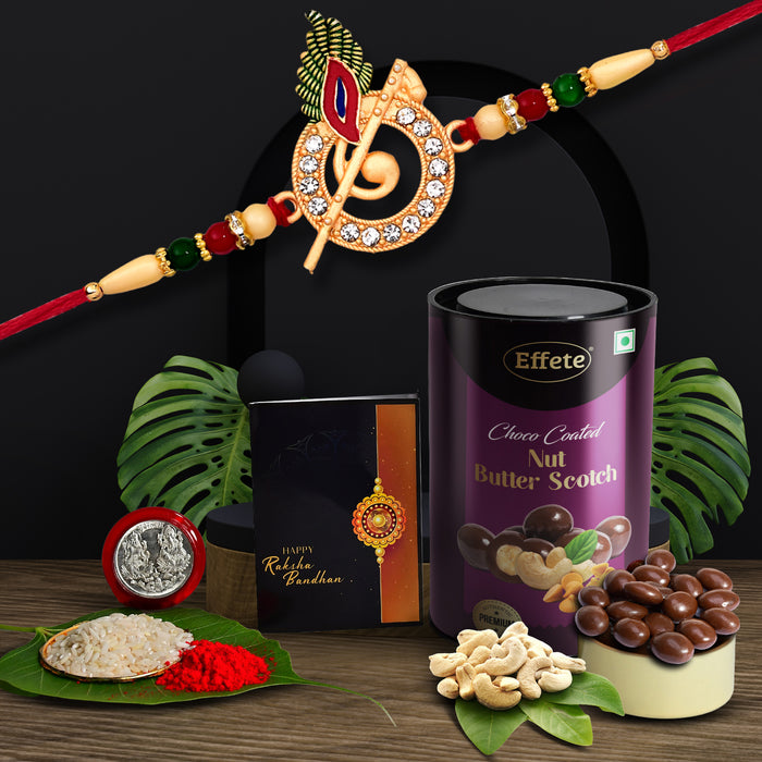 Krishna Rakhi Combo with Effete Butterscotch Chocolate nuts 96gm, Silver Color Pooja Coin, Roli Chawal & Greeting Card