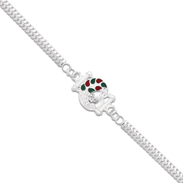 Elegant silver finish rakhi with red and green enamel, ready for Raksha Bandhan celebrations.