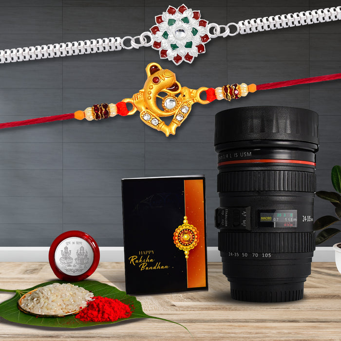 Ganesha And Flower Silver Color Rakhi With Coffee Camera Lense Mug ,Silver Color Pooja Coin, Roli Chawal & Greeting Card