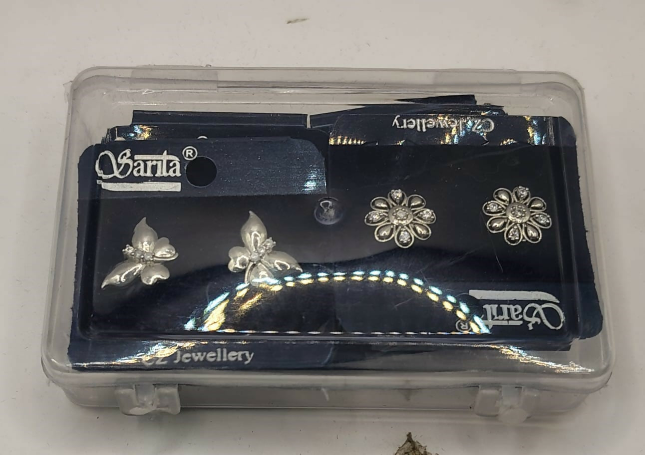 Combo pack of four silver plated stud earrings featuring floral and butterfly themes