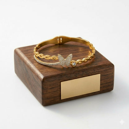 Close-up of floral design on gold-tone botanical kada bracelet