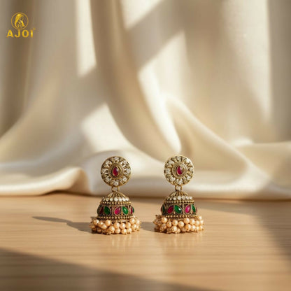 Front view showing detailed dome-shaped jhumka with stones and pearls