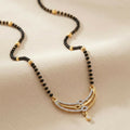 Elegant Gold and Diamond Mangalsutra with Traditional Black Beads