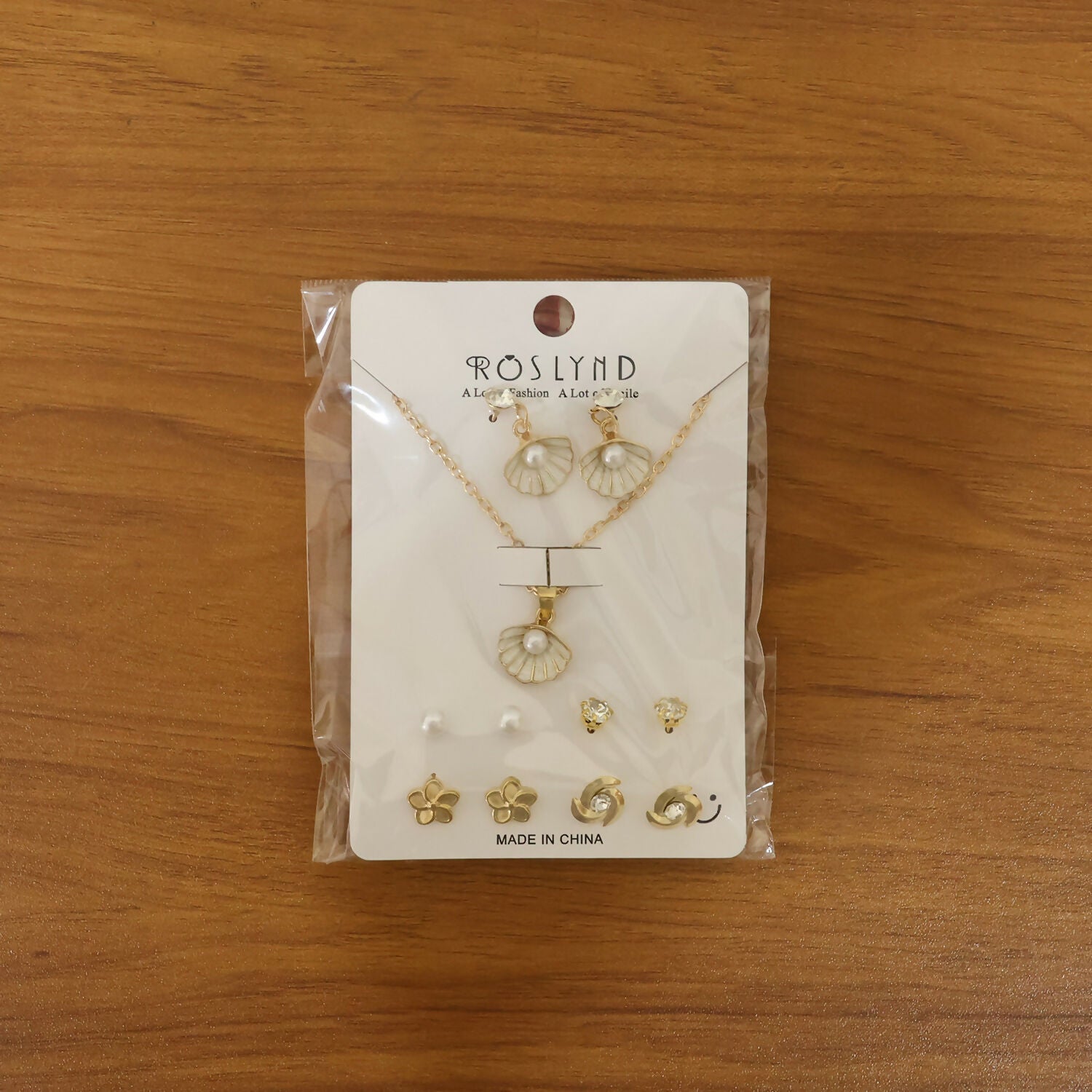 Full set of six gold-plated shell pearl earrings including stud and drop styles