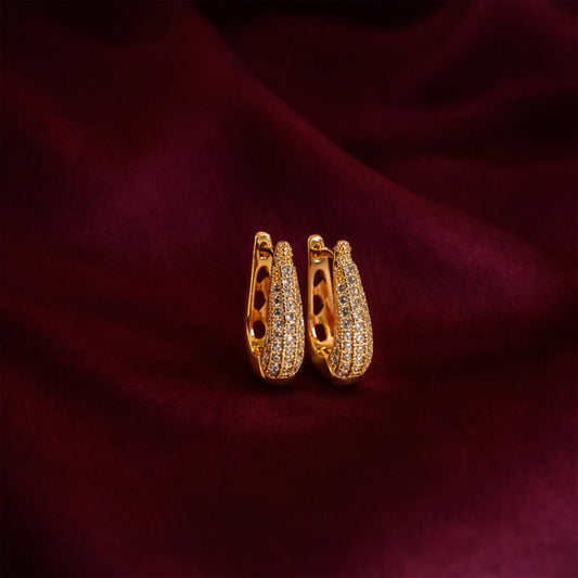 Elegant Curved Pavé Crystal Huggie Earrings in Gold Finish