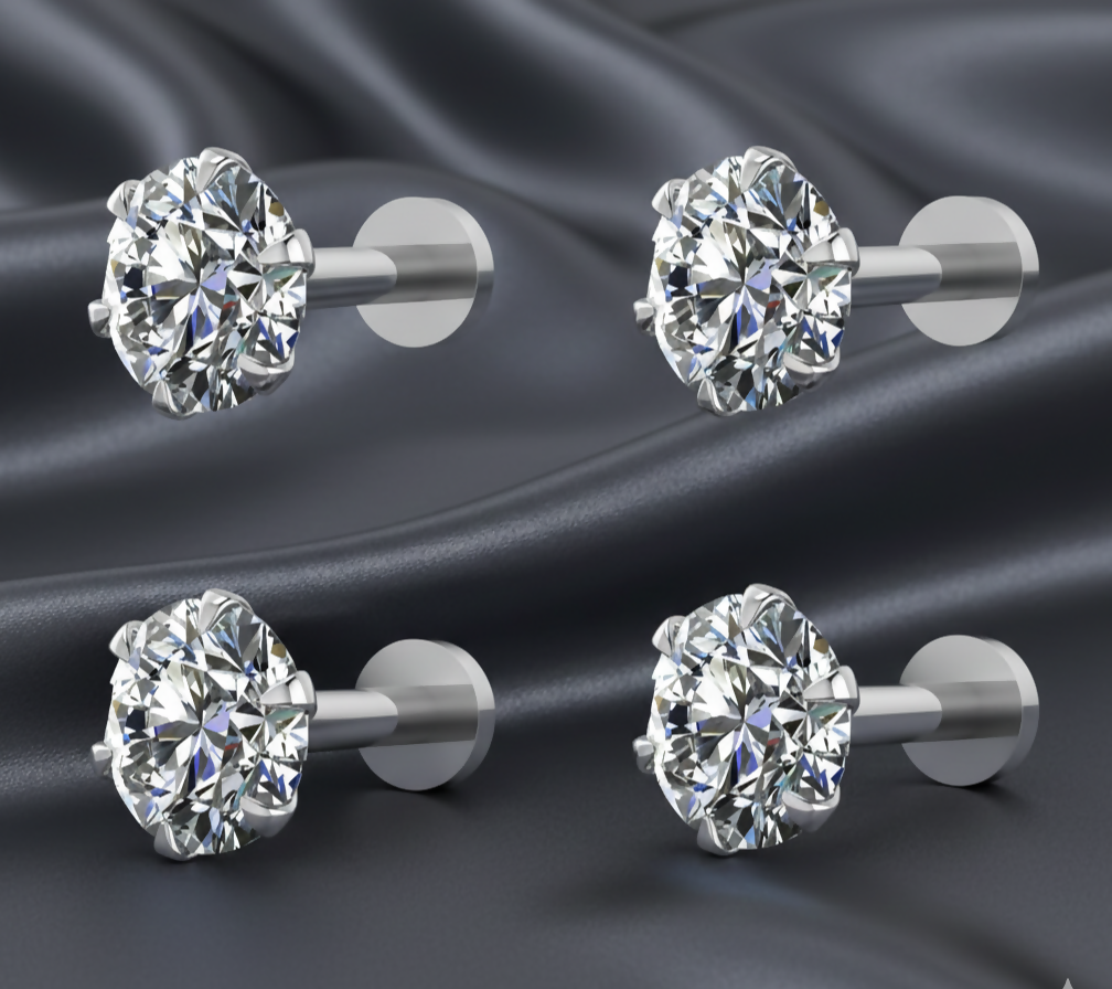 Close-up of silver plated round cubic zirconia stud earring with flat backing