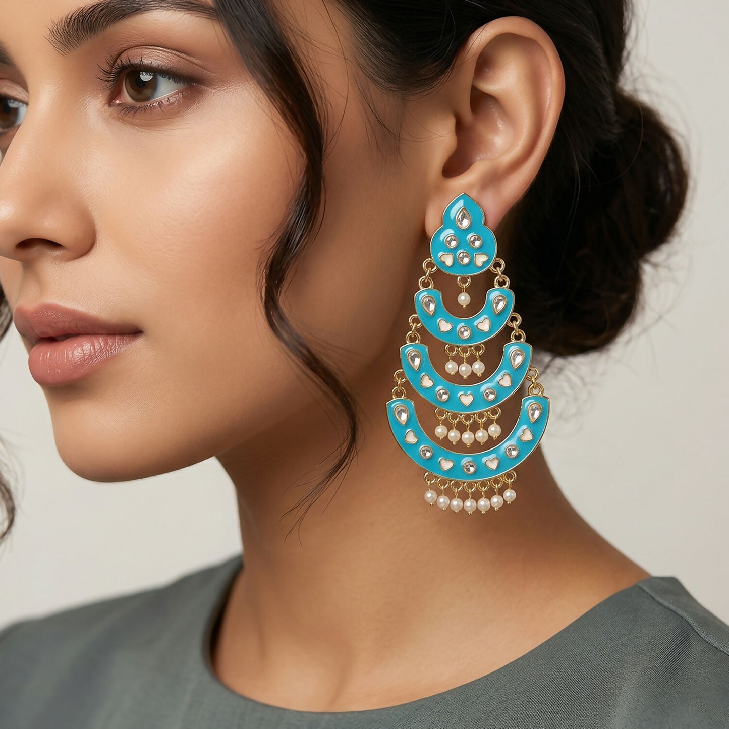 Close-up of decorative stones on sky blue chandbali earrings