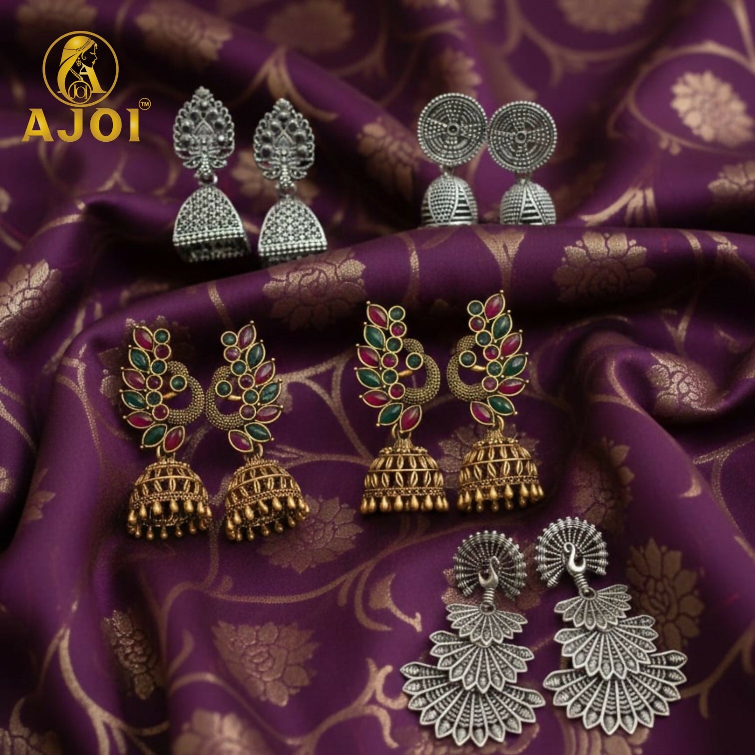 Elegant stone-accented peacock temple earrings in antique gold and oxidized silver finish